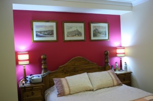 Walls are Spanish Cream and feature wall uses Deep Red from the Dulux Colour Range.The ceiling used the normal vivid white for the first coat and the pink-to-white for the second coat.